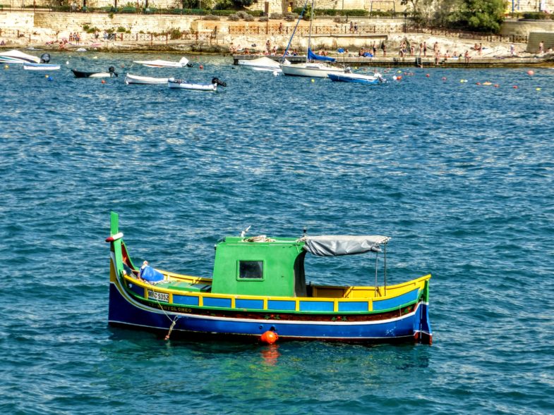 Maltese Luzzu in St Julian's Bay, north Malta
